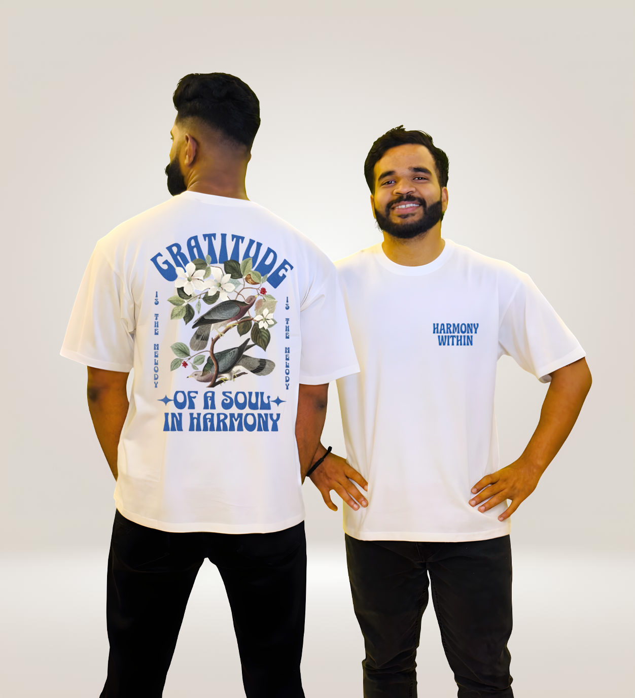 Model wearing white Gratitude in Harmony graphic oversized tee, styled with black pants, motivational streetwear look