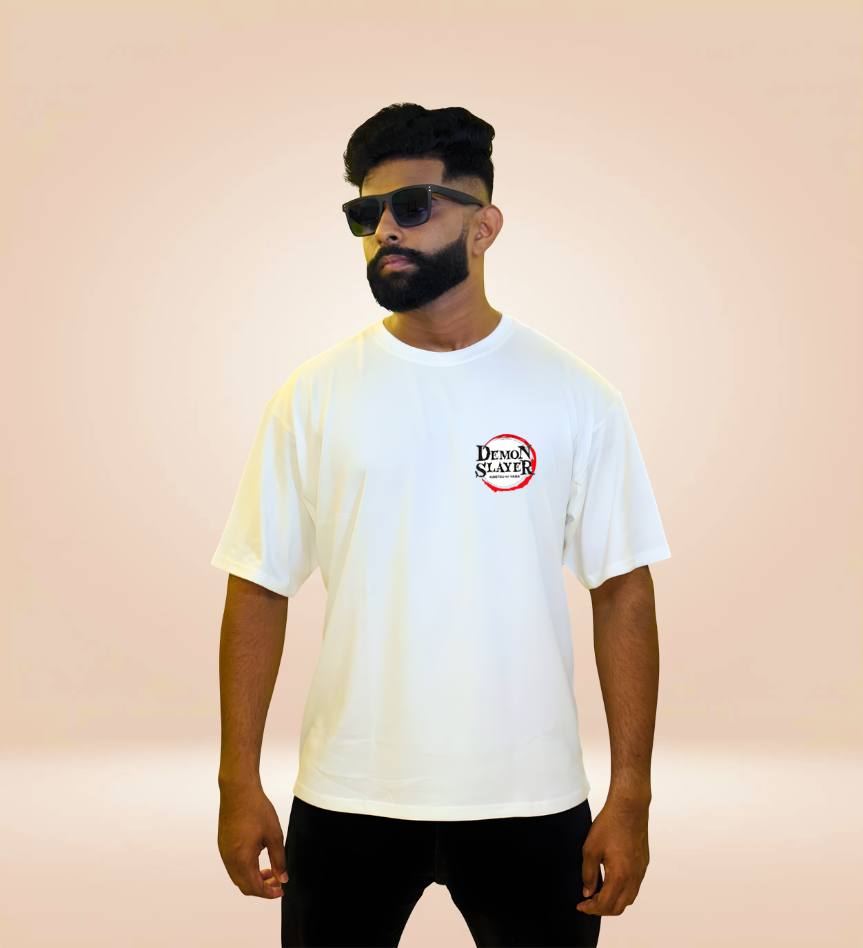 White oversized Demon Slayer T-shirt with front logo, worn by man.