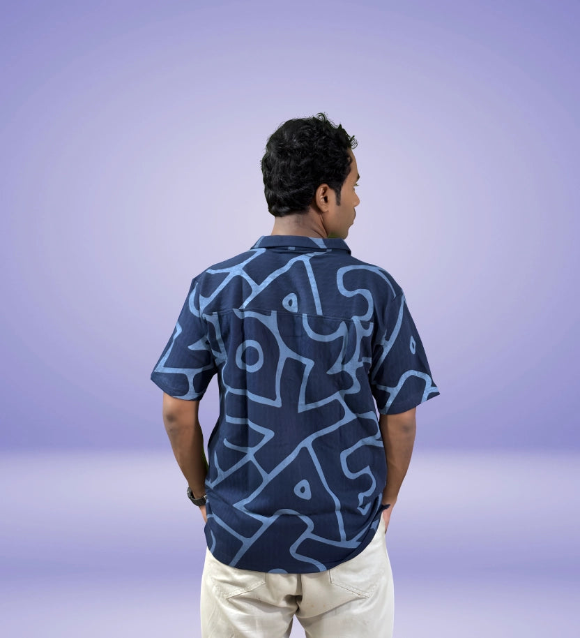 Back view of navy relaxed fit shirt with bold abstract oversized pattern