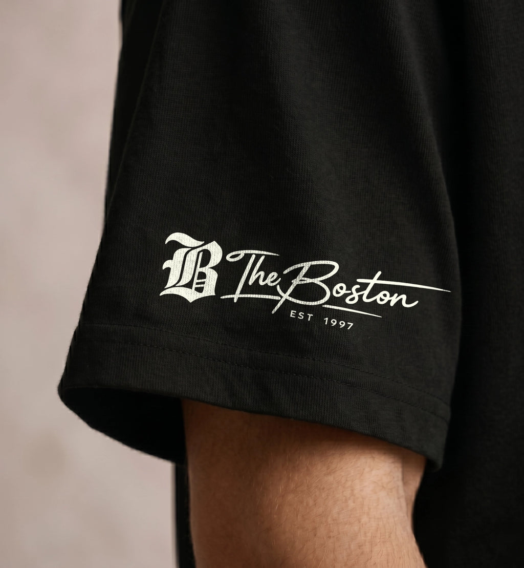 Black oversized t-shirt sleeve detail with Boston typography print