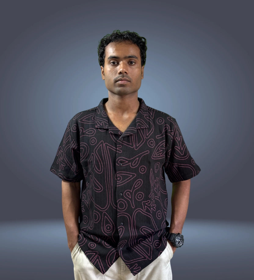 Front view of black relaxed fit shirt with minimal abstract print