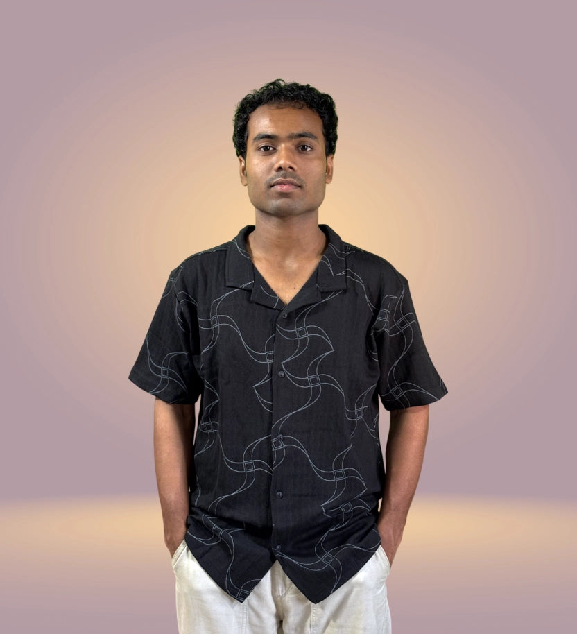 Front view of black relaxed fit shirt with wavy abstract line print