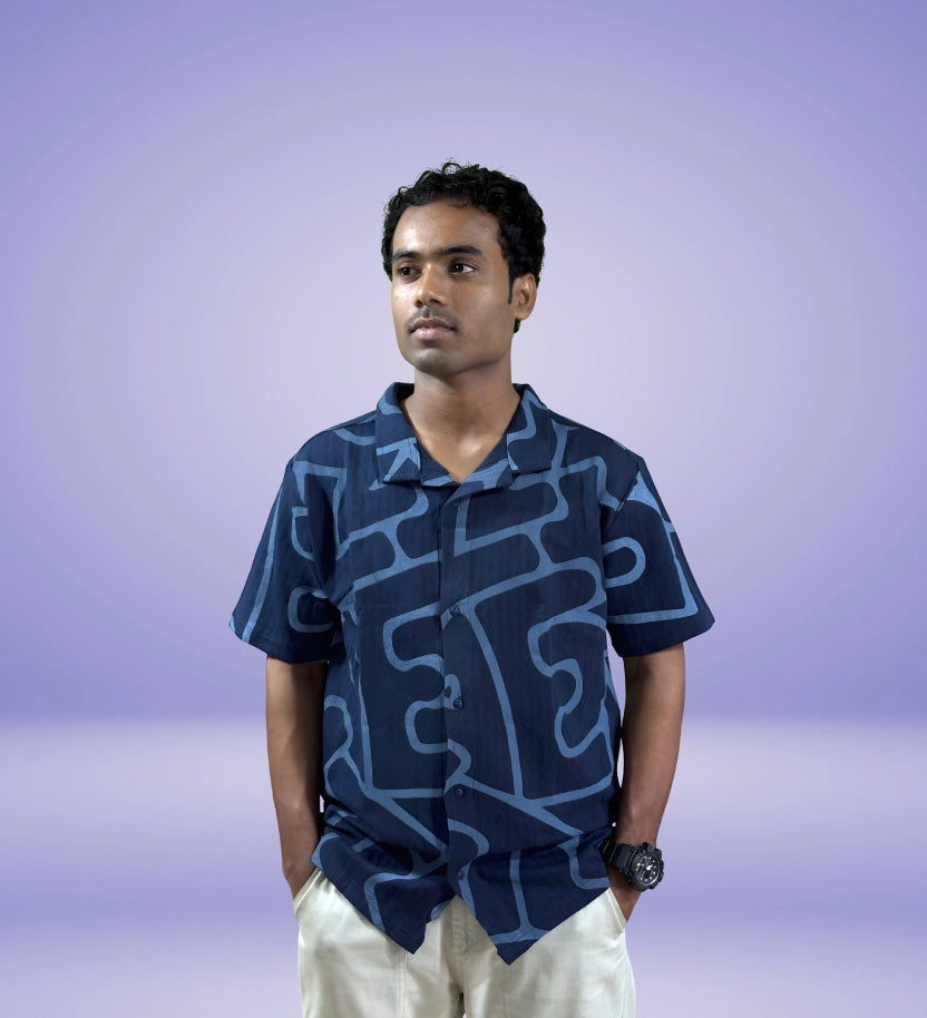 Front view of navy abstract print relaxed fit shirt on model