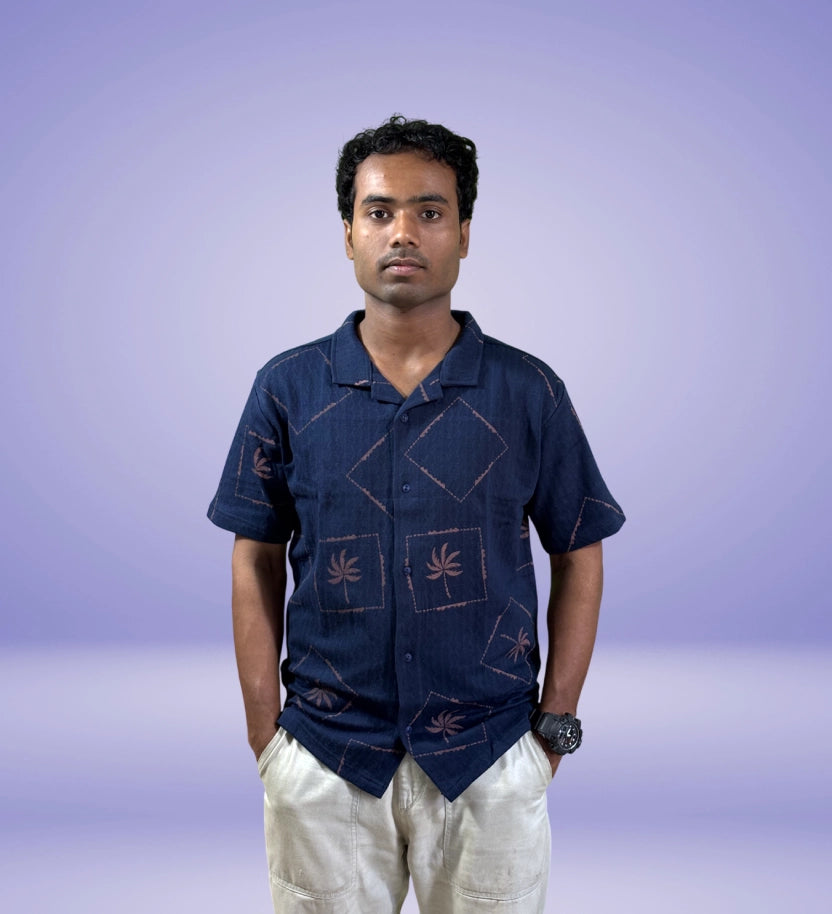 Front view of navy shirt with tropical patch print and relaxed fit