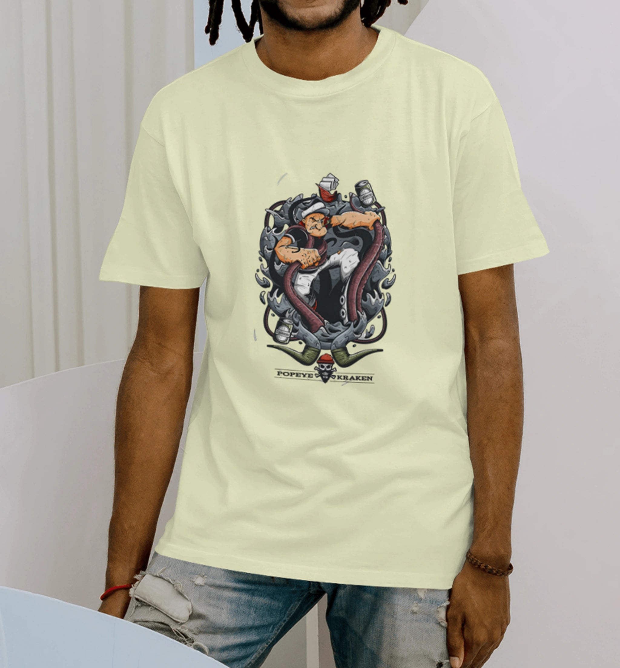 Model wearing AAMS Popeye vs Kraken Graphic Printed Unisex T-Shirt in cream – 100% Cotton Premium Streetwear