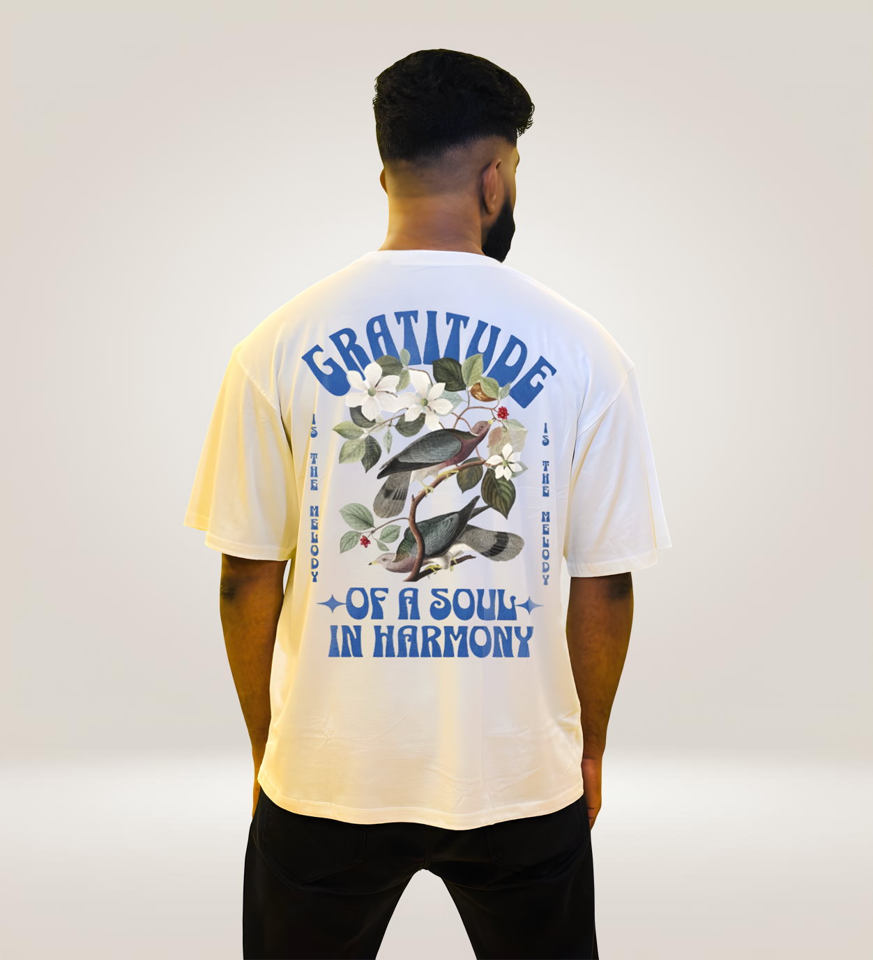 White oversized Gratitude in Harmony graphic t-shirt back, bird and flower motivational print