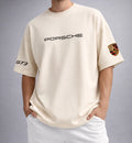 Men wearing cream Porsche GT3 oversized t-shirt with minimal logo design